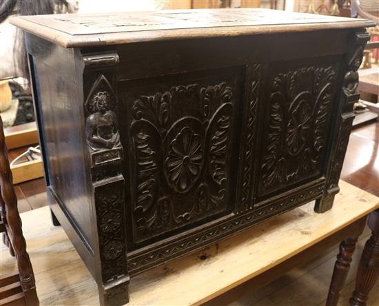 A carved oak coffer, W.91cm